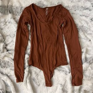 The Kit Undergarments Long Sleeve Thong Bodysuit in Cinnamon